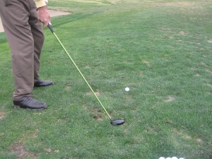 aiming left, cutting across the ball and hitting a golf slice