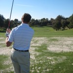 golfer walks through pre shot routine hitting a golf shot