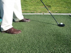 golfer aligned right hitting a pushed golf shot