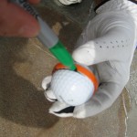 Marking your golf ball using a plastic ring from a Gatorade bottle cap